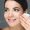portrait of smiling woman with beautiful white teeth and dental floss isolated on grey